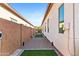 Side yard featuring gravel groundcover with turf accents; a minimal water landscape that is easy to maintain at 1492 W Bruce Ave, Gilbert, AZ 85233