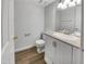 Bathroom featuring a toilet, granite countertops, a sink, and white vanity at 1750 E Mateo Cir # 103, Mesa, AZ 85204