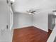 Light-filled bedroom with hardwood floors, a modern ceiling fan, and ample natural light at 1750 E Mateo Cir # 103, Mesa, AZ 85204