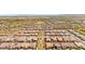Expansive aerial view of a community with neatly planned streets and desert landscaping at 17597 W Red Fox Rd, Surprise, AZ 85387