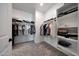Spacious walk-in closet with ample storage, featuring organized shelving and hanging rods for clothing and accessories at 17597 W Red Fox Rd, Surprise, AZ 85387