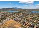 Picturesque aerial view capturing rooftops in a vibrant community near sparkling blue lakes and desert landscape at 18132 W Cardinal Dr, Goodyear, AZ 85338