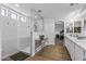 Bright bathroom featuring walk-in shower, neutral color scheme, and hardwood floors at 18132 W Cardinal Dr, Goodyear, AZ 85338