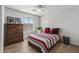 Bedroom with natural light, a ceiling fan, and wood-look floors at 18132 W Cardinal Dr, Goodyear, AZ 85338