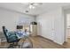 Bedroom showcasing desk, a light-colored closet, and wood-look flooring at 18132 W Cardinal Dr, Goodyear, AZ 85338