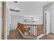 Second-floor hallway with wood floors and a view of the surrounding mountains at 18132 W Cardinal Dr, Goodyear, AZ 85338