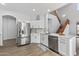 Bright kitchen boasts stainless steel appliances, white cabinets, and modern countertops at 18132 W Cardinal Dr, Goodyear, AZ 85338