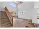 Bright open-concept space features soaring ceilings, staircase, and seamless transition to the patio at 18132 W Cardinal Dr, Goodyear, AZ 85338
