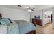 Spacious main bedroom suite boasting hardwood floors, luxury furnishings, and an attached bathroom at 18132 W Cardinal Dr, Goodyear, AZ 85338