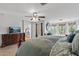 Spacious main bedroom suite boasting hardwood floors, large windows, and luxury furnishings at 18132 W Cardinal Dr, Goodyear, AZ 85338