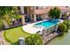 Aerial view of luxury backyard, showing pool, patio, putting green, and waterfront at 1834 E Willow Tree Ct, Gilbert, AZ 85234