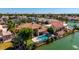 Aerial view of luxury home on canal, showcasing pool, landscaping, and neighborhood at 1834 E Willow Tree Ct, Gilbert, AZ 85234
