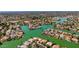 Expansive aerial view of waterfront homes on interconnected waterways and mature landscaping at 1834 E Willow Tree Ct, Gilbert, AZ 85234