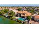 Aerial view of upscale residential neighborhood with lakefront property and lush greenery at 1834 E Willow Tree Ct, Gilbert, AZ 85234
