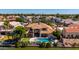 Aerial view showcasing luxury homes, lakefront property, pools, and landscaping at 1834 E Willow Tree Ct, Gilbert, AZ 85234