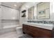 Modern bathroom with double vanity, decorative backsplash, and tiled shower at 1834 E Willow Tree Ct, Gilbert, AZ 85234