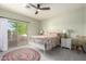 Light-filled bedroom with balcony access and neutral decor at 1834 E Willow Tree Ct, Gilbert, AZ 85234