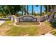 Decorative Val Vista Lakes Clubhouse sign with flowers and manicured lawn at 1834 E Willow Tree Ct, Gilbert, AZ 85234