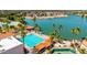 Community pool featuring lap lanes, lounge chairs, palm trees and lake views at 1834 E Willow Tree Ct, Gilbert, AZ 85234