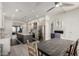 Modern kitchen with gray island, stainless steel appliances, and view to the living and dining area at 1834 E Willow Tree Ct, Gilbert, AZ 85234