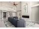 Expansive living area featuring a modern fireplace, two-story ceilings, and a spacious seating area at 1834 E Willow Tree Ct, Gilbert, AZ 85234
