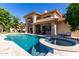 Beautiful backyard featuring a luxury pool and spa at a large home at 1834 E Willow Tree Ct, Gilbert, AZ 85234