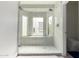 Elegant walk-in shower featuring frameless glass enclosure and decorative, hexagon tile floor at 1834 E Willow Tree Ct, Gilbert, AZ 85234
