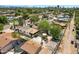 Aerial backyard view showcasing mature trees, patio, and privacy, complete with an outdoor dining area and lush greenery at 1940 E Indianola E Ave, Phoenix, AZ 85016