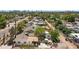 Overhead backyard shot exhibiting a well-kept outdoor space featuring a patio, trees, and neighborhood surroundings at 1940 E Indianola E Ave, Phoenix, AZ 85016
