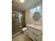 Bathroom featuring a glass-enclosed shower, modern vanity, and updated fixtures at 1940 E Indianola E Ave, Phoenix, AZ 85016