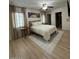 Spacious main bedroom featuring a comfortable bed, ceiling fan, and neutral decor at 1940 E Indianola E Ave, Phoenix, AZ 85016