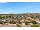 Scenic neighborhood view with single-Gathering homes and tree-lined streets against a backdrop of mountains on a clear day at 1940 E Indianola E Ave, Phoenix, AZ 85016