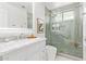 Modern bathroom featuring marble countertop vanity, frameless shower, and sleek fixtures at 1953 W Lark Dr, Chandler, AZ 85286