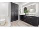 Bathroom featuring dual sinks, modern cabinets, and ample storage space at 1953 W Lark Dr, Chandler, AZ 85286