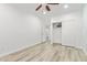 Neutral bedroom features wood-look floors, white trim, and closet with sliding doors at 1953 W Lark Dr, Chandler, AZ 85286