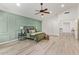 A cozy bedroom with a stylish ceiling fan and a custom paneled wall at 1953 W Lark Dr, Chandler, AZ 85286