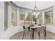 Bright dining area features a modern chandelier and large windows with outdoor views at 1953 W Lark Dr, Chandler, AZ 85286