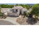 Elegant home showcasing a well-manicured front yard and a three car garage at 1953 W Lark Dr, Chandler, AZ 85286