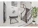 Bright foyer featuring marble floors, a curved staircase, and a stylish bench at 1953 W Lark Dr, Chandler, AZ 85286
