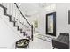 Welcoming foyer with marble floors, a grand staircase, and decorative floral arrangement at 1953 W Lark Dr, Chandler, AZ 85286