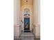 Elegant front door with decorative ironwork, a stylish chandelier, and a welcoming entrance at 1953 W Lark Dr, Chandler, AZ 85286