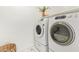 Laundry room with new front loading washer and dryer and tile floor at 1953 W Lark Dr, Chandler, AZ 85286