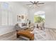 Bright living room with ceiling fan, stylish furniture, arched windows, and a comfortable layout at 1953 W Lark Dr, Chandler, AZ 85286