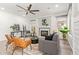 Inviting living room featuring a cozy fireplace, comfortable seating, and bright natural light at 1953 W Lark Dr, Chandler, AZ 85286