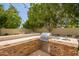 Outdoor kitchen featuring a stainless steel BBQ, sink and ample stone counter space at 1953 W Lark Dr, Chandler, AZ 85286