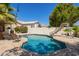 Sparkling pool features a slide, lounge chairs, and beautiful desert landscaping at 1953 W Lark Dr, Chandler, AZ 85286
