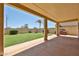 Beautiful backyard with lush lawn, covered patio, and a custom outdoor grilling area at 21141 N 79Th Ave, Peoria, AZ 85382