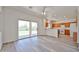 Bright open living space with neutral flooring, sliding doors to the backyard and access to the kitchen at 21141 N 79Th Ave, Peoria, AZ 85382