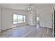 Generous main bedroom with wood-look floors and a view to the Primary bath at 21141 N 79Th Ave, Peoria, AZ 85382