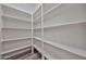Walk-in pantry featuring extensive shelving for optimal organization at 21141 N 79Th Ave, Peoria, AZ 85382